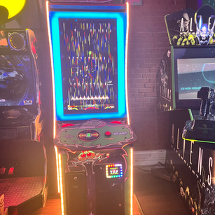 Arcade game cabinet 20 on the floor at 1UP Arcade Bar